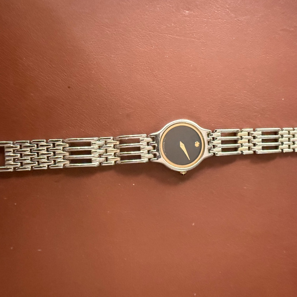 Silver and Black Watch with Gold Accents